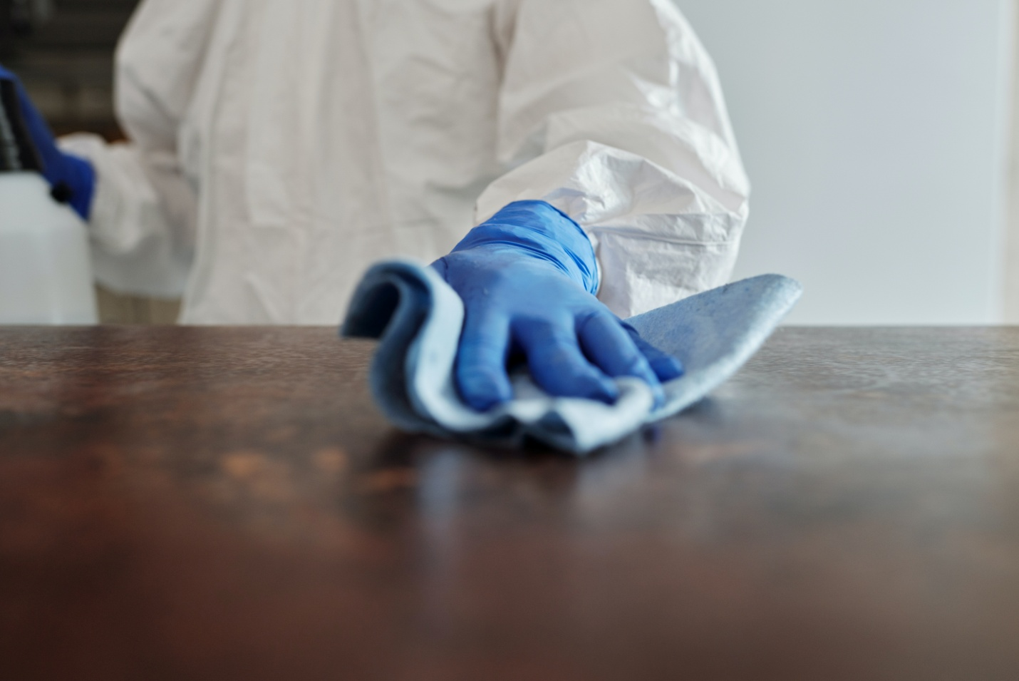 A person providing janitorial service inside the office.