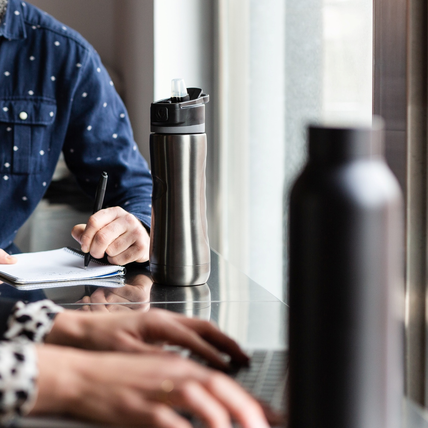 employees bringing reusable water bottles to work 