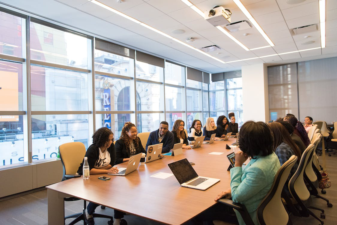 A group of employees in a clean conference room