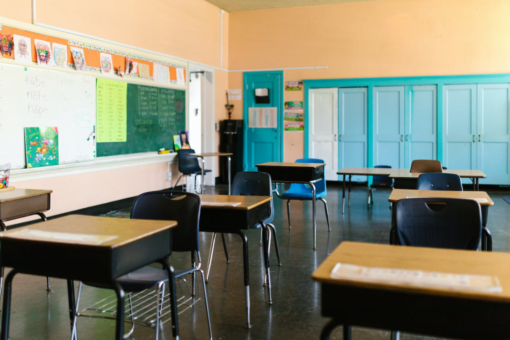 Wooden tables and chairs in a clean classroom