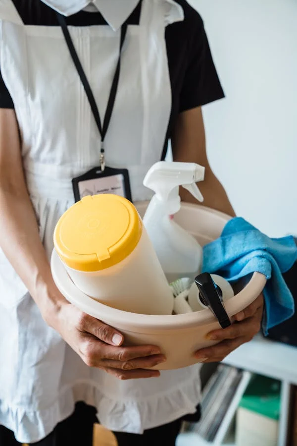 Janitorial staff using eco-friendly cleaning products, contributing to sustainability and a safer work environment.