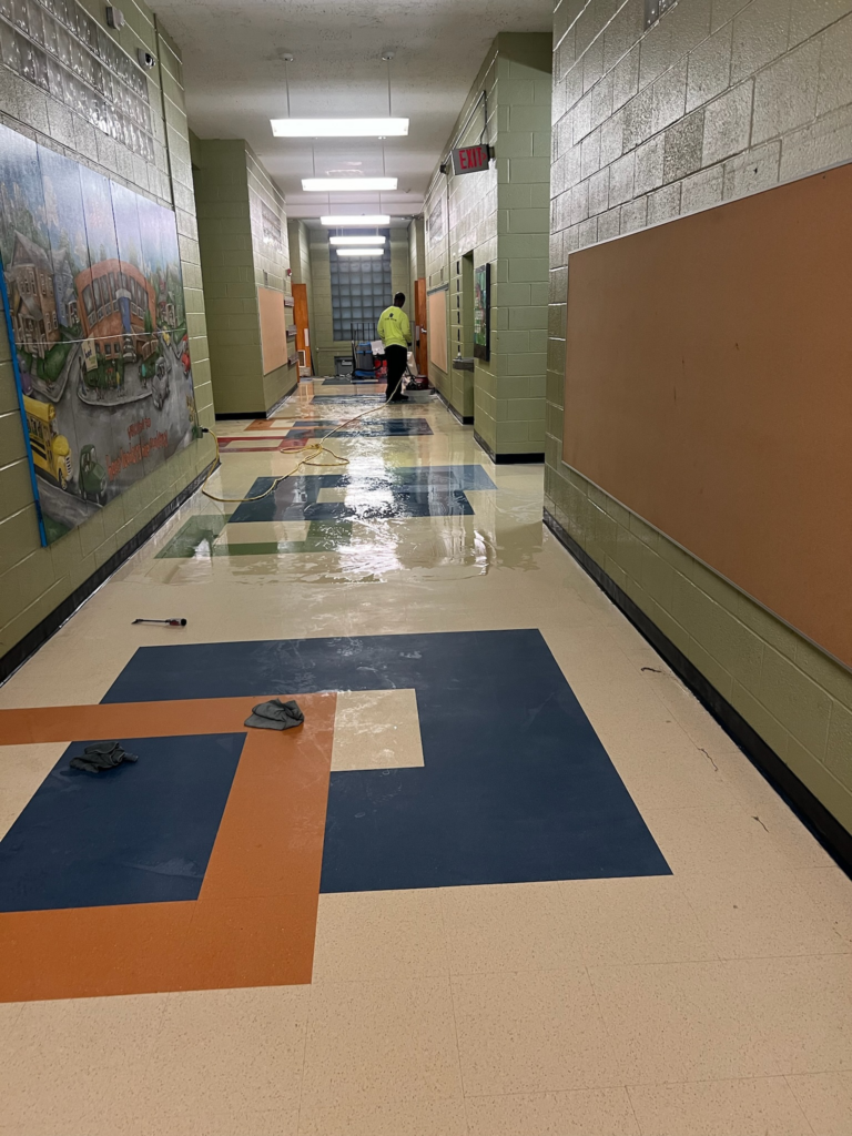 An image of a school hallway being cleaned