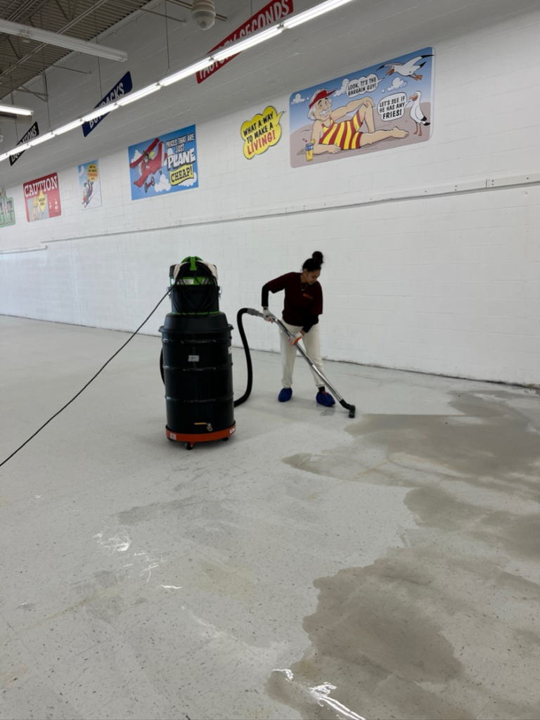 a woman cleaning a commercial space.
