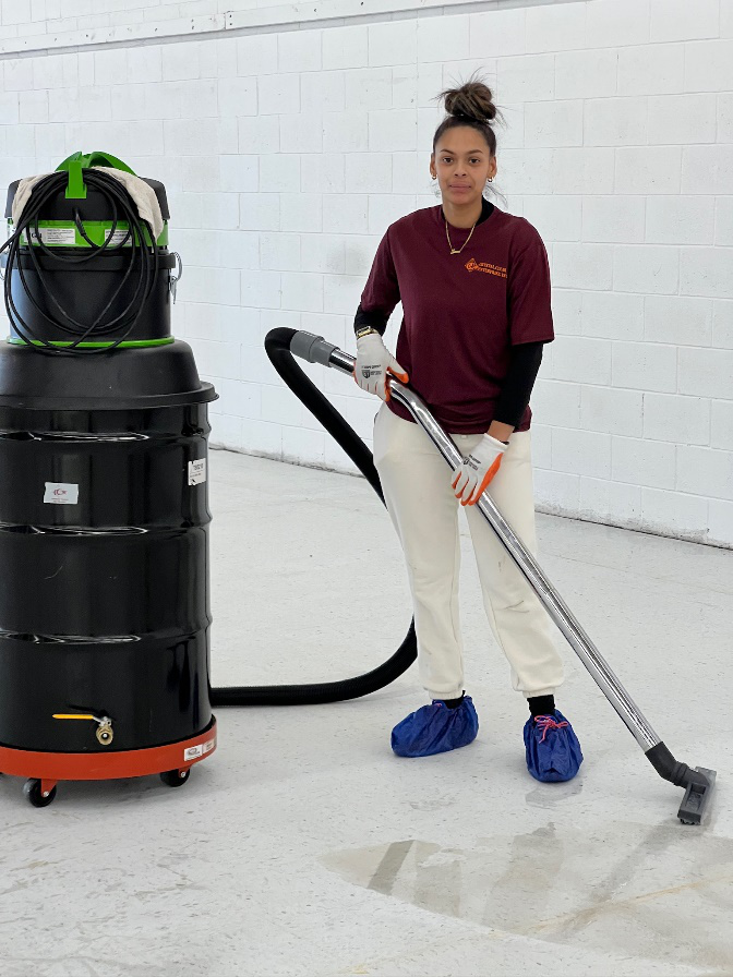 A woman using high-grade cleaning equipment for floor cleaning services