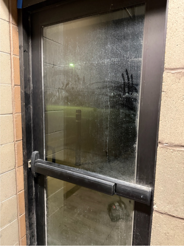 Dirty door needs cleaning at a secure facility