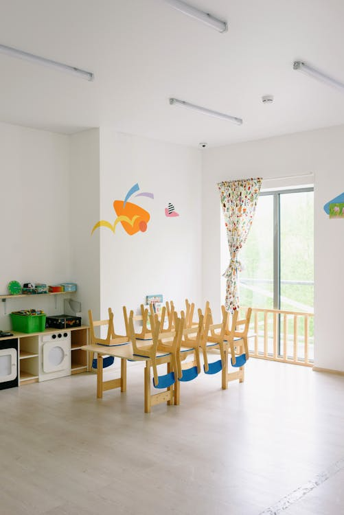 An image of a clean classroom with chairs set upside down