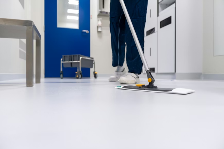 An image of a person mopping the floor