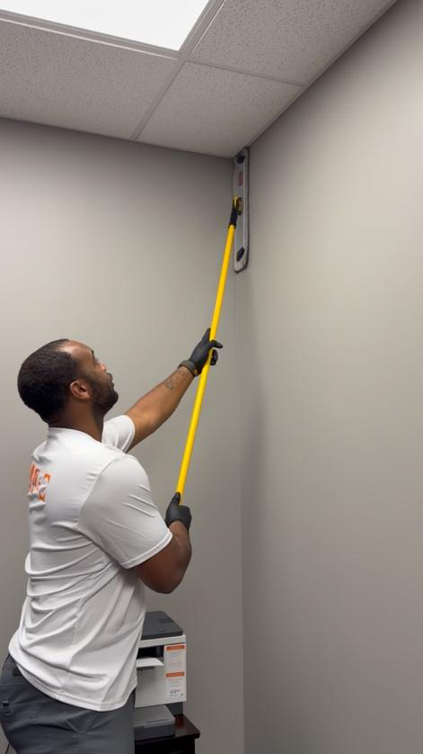 Wall cleaners at work inside the office building