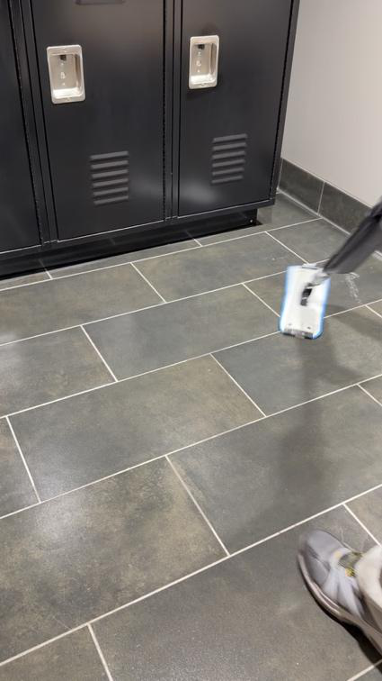 Person vacuuming the floor