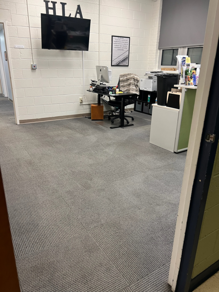 an office space with a carpeted floor