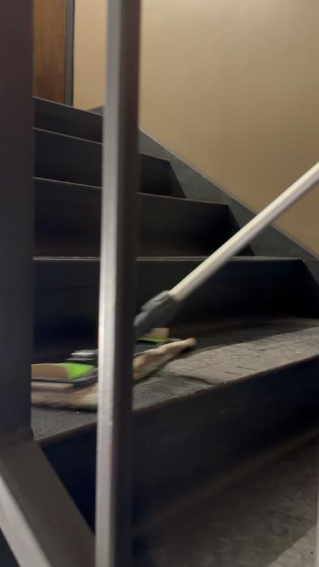 Person cleaning the stairs