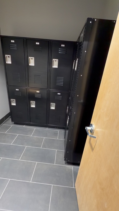 Access-controlled locker area at a secure commercial facility