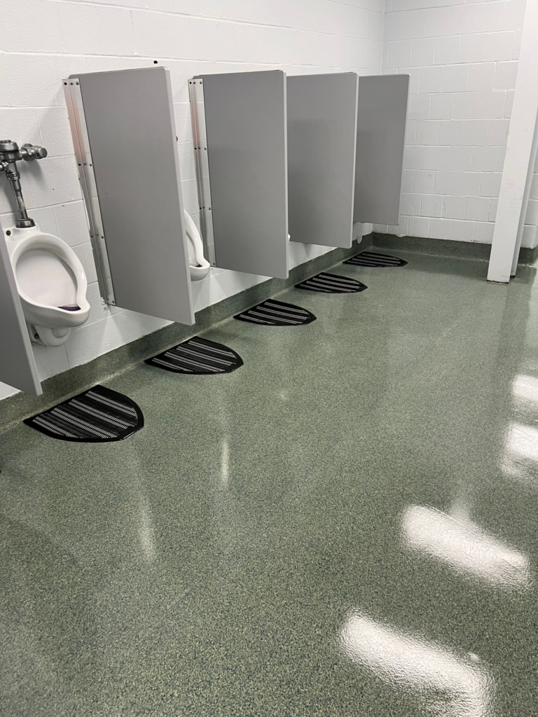 a school washroom with cleaned floor