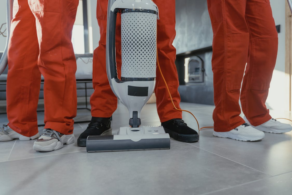 Commercial floor cleaning service using professional vacuum equipment.