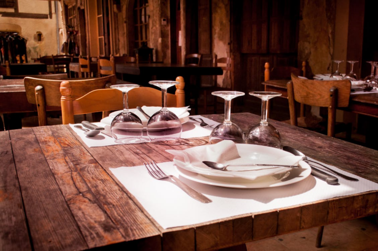 A table and chair in a restaurant.
