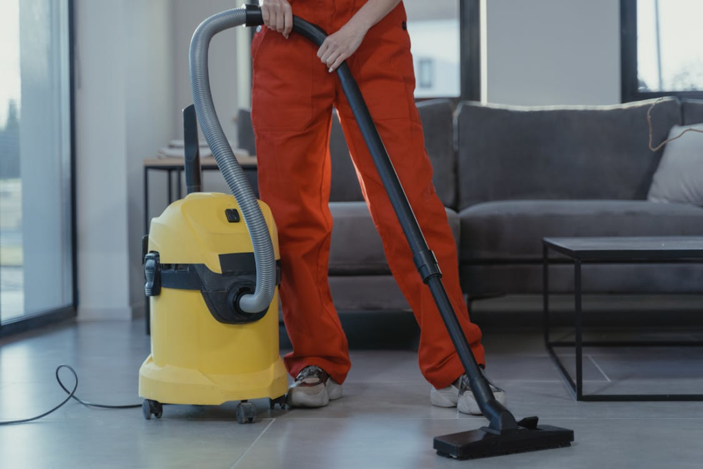 Workers performing commercial floor cleaning services in a corporate lobby